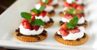 Chocolate and Cream Strawberry Snacks - Dark chocolate, whipped cream, and sweet strawberries topped on a RITZ® cracker. A perfect snack to satisfy a sweet craving! #PutItOnARitz #Ad